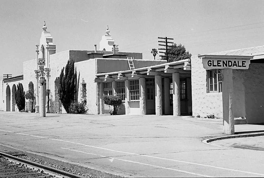 black and white photo of railroad station