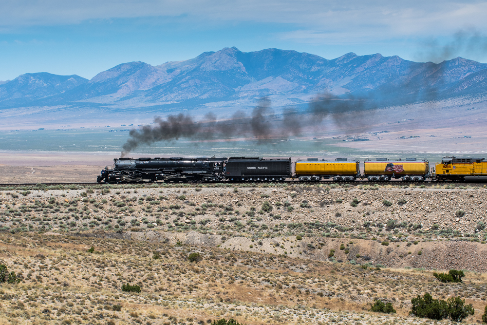 Side view of steam locomotive across desert. Elrond Lawrence photo