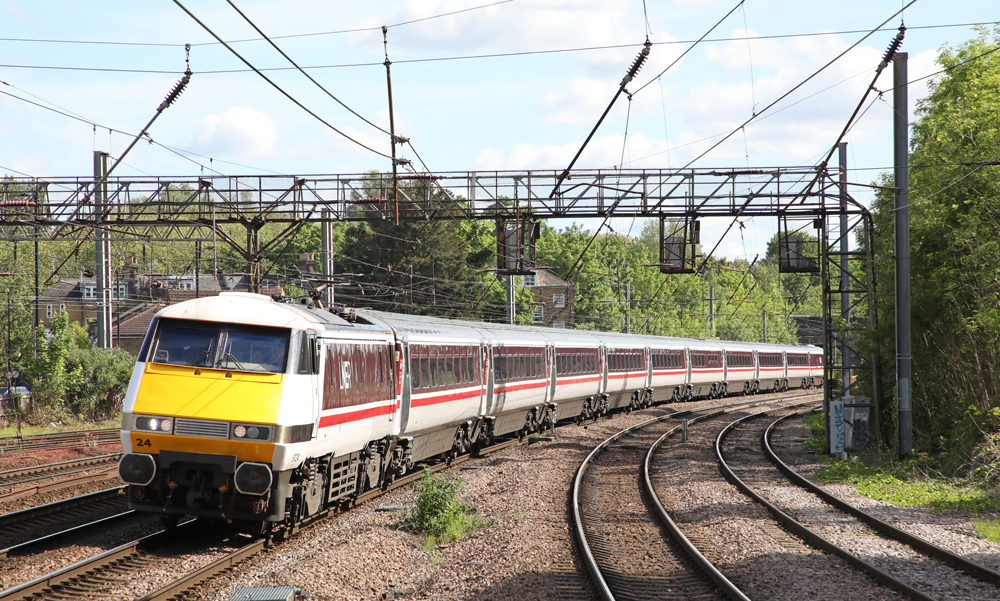 White British train with yellow nose and red stripe