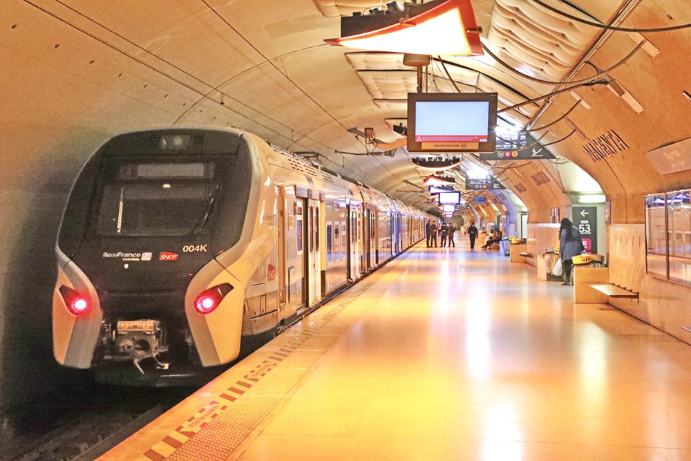 Commuter rail train in underground station in Paris