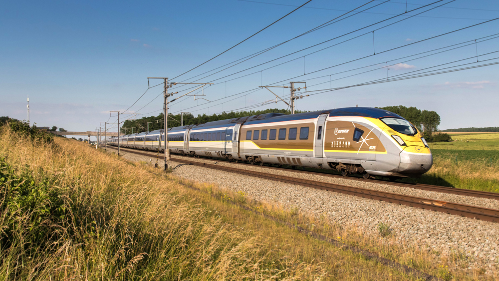 High speed trainset featuring power car with gold trim