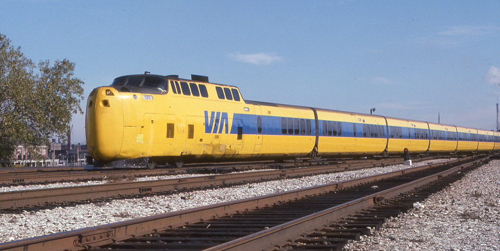 Yellow and blue articulated passenger train