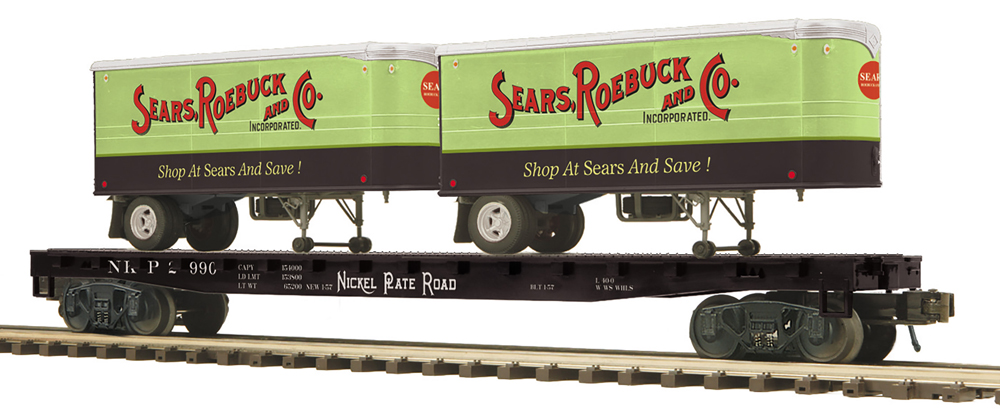 model flatcar with green and red trailer loads