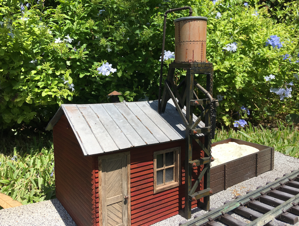 model sand house on garden railway