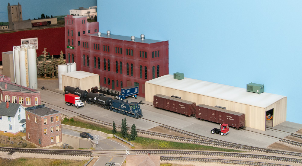 An HO scale model brewery complex with several different kinds of buildings