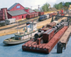 Color photo of harbor scene on model railroad.
