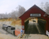 Photo of train passing under covered bridge on model railroad.