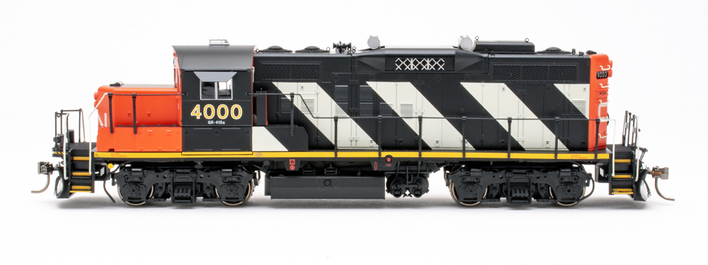 Side view of HO scale diesel locomotive on white background.