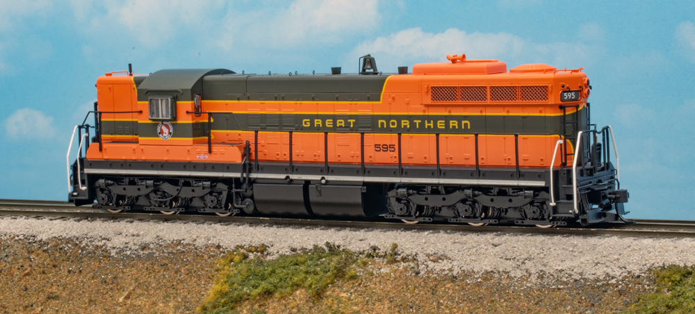 Color photo of HO scale diesel on scenic base.