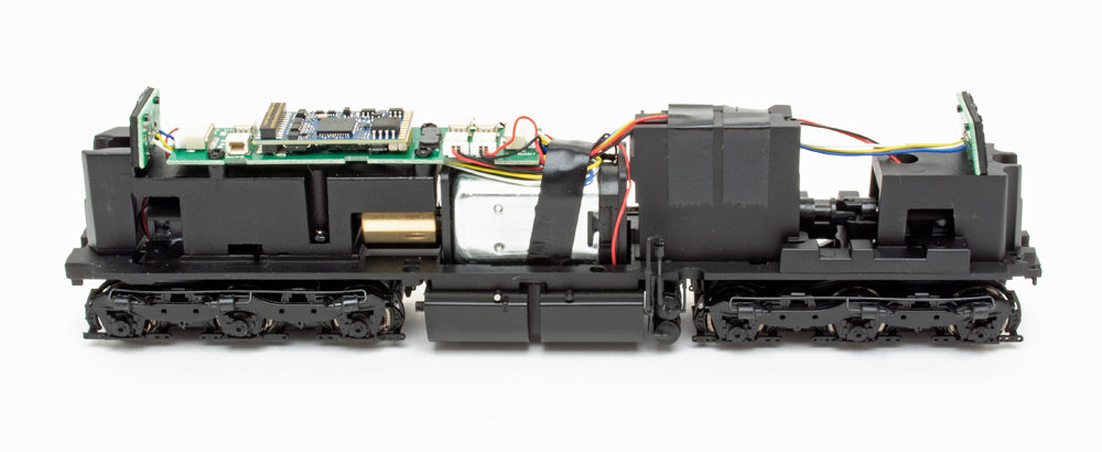 Color photo showing mechanism of HO scale diesel locomotive.