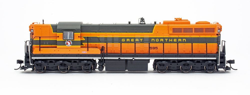 Side view of HO scale diesel painted orange, green, yellow, and black.