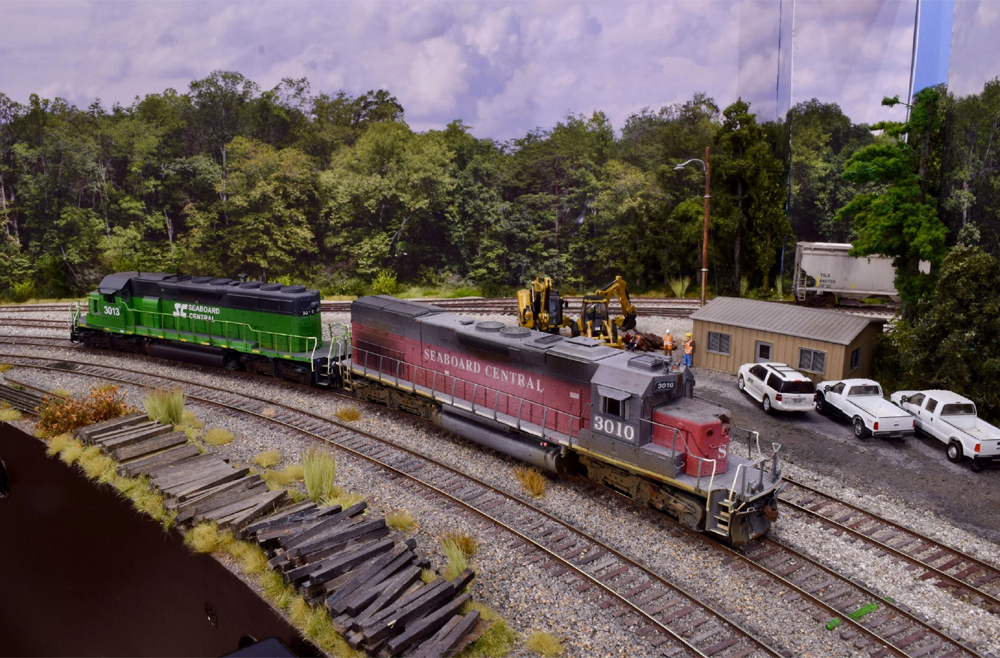 red and green locomotives on train layout