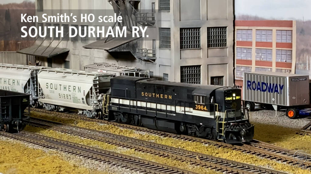 Title screen showing black-and-white road diesel pulling a freight on Ken Smith's HO scale South Durham Ry. model railroad.