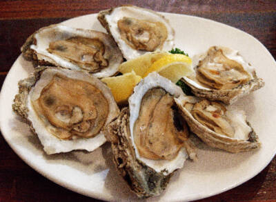 A plate with six steamed oysters and lemons. Five mind-blowing facts — Stilwell oyster car