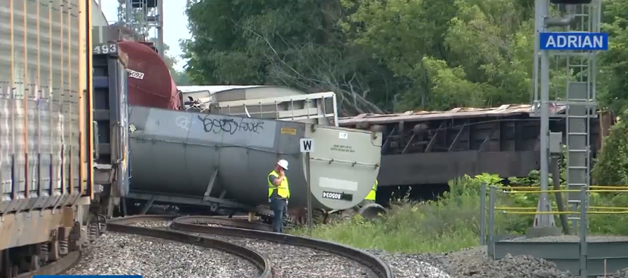 Derailed freight cars at crossing