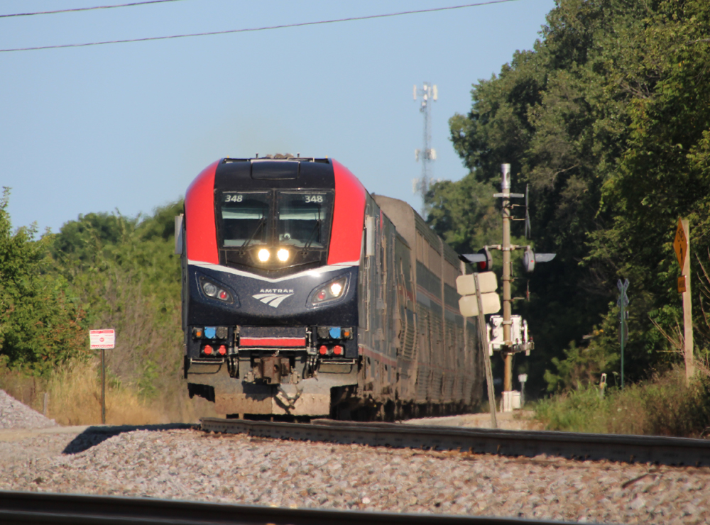 Passenger train at grade crossing