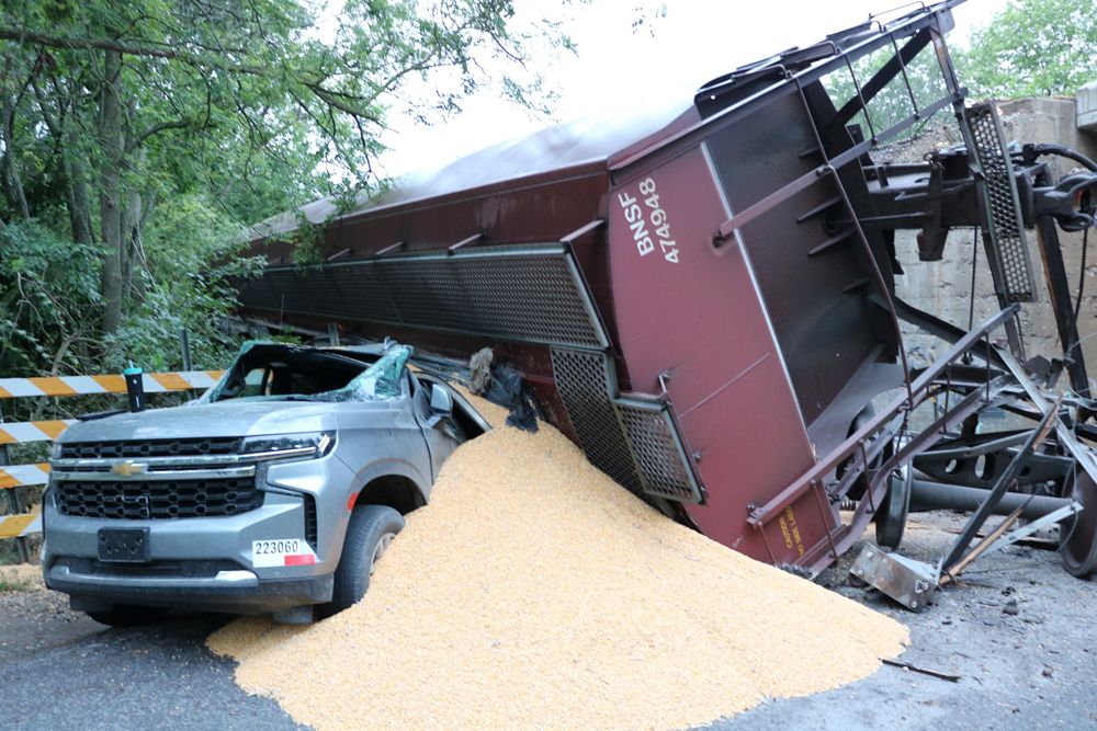 Grain hopper and damaged SUV