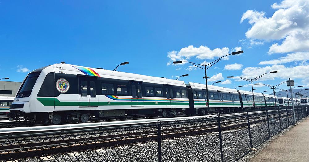 Four-car light rail trainsets at yard