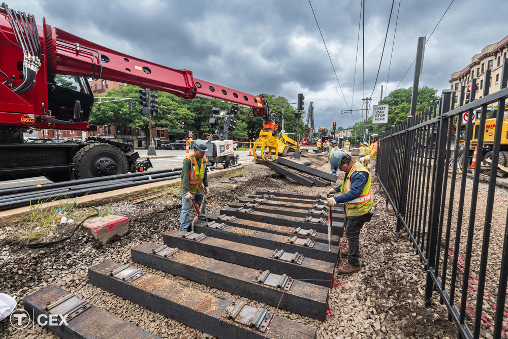 Ties are placed on roadbed by track workers