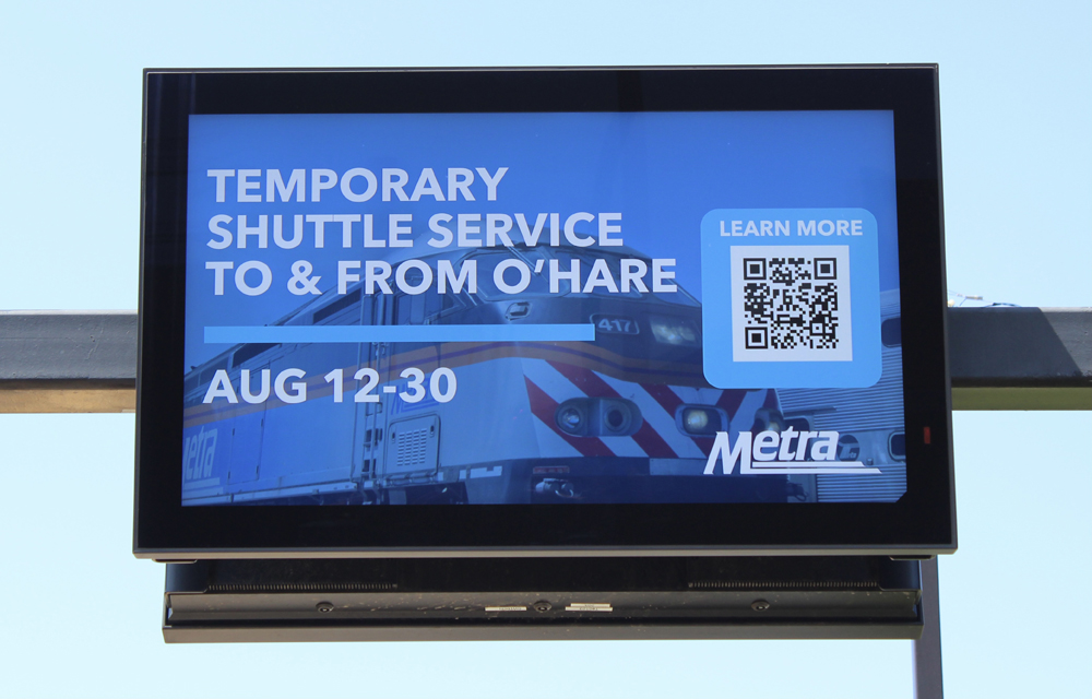 Video display board at the station advertises the O'Hare Shuttle service