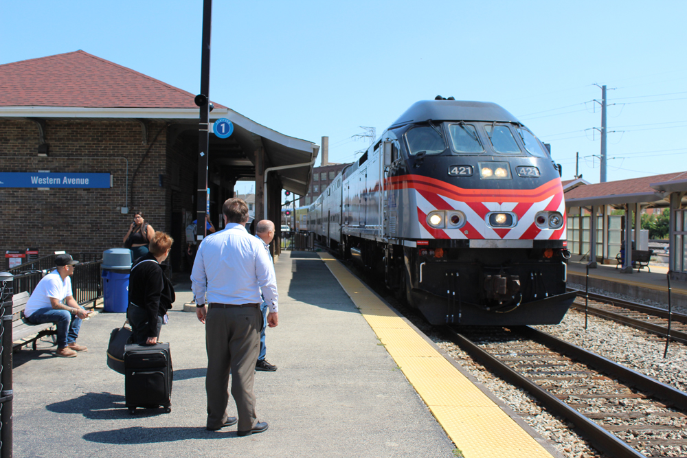 People waiting on the platform for a Metra train