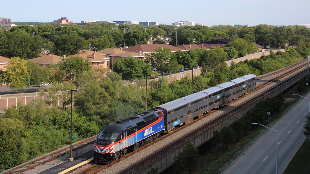 View of three-car train from atop building