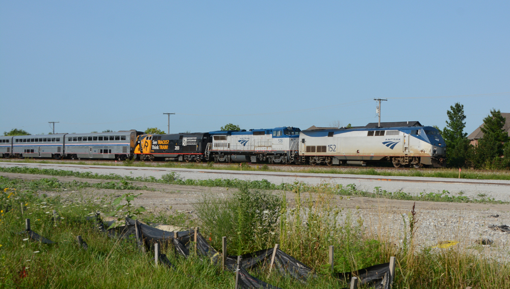 Three locomotives at front of passenger train