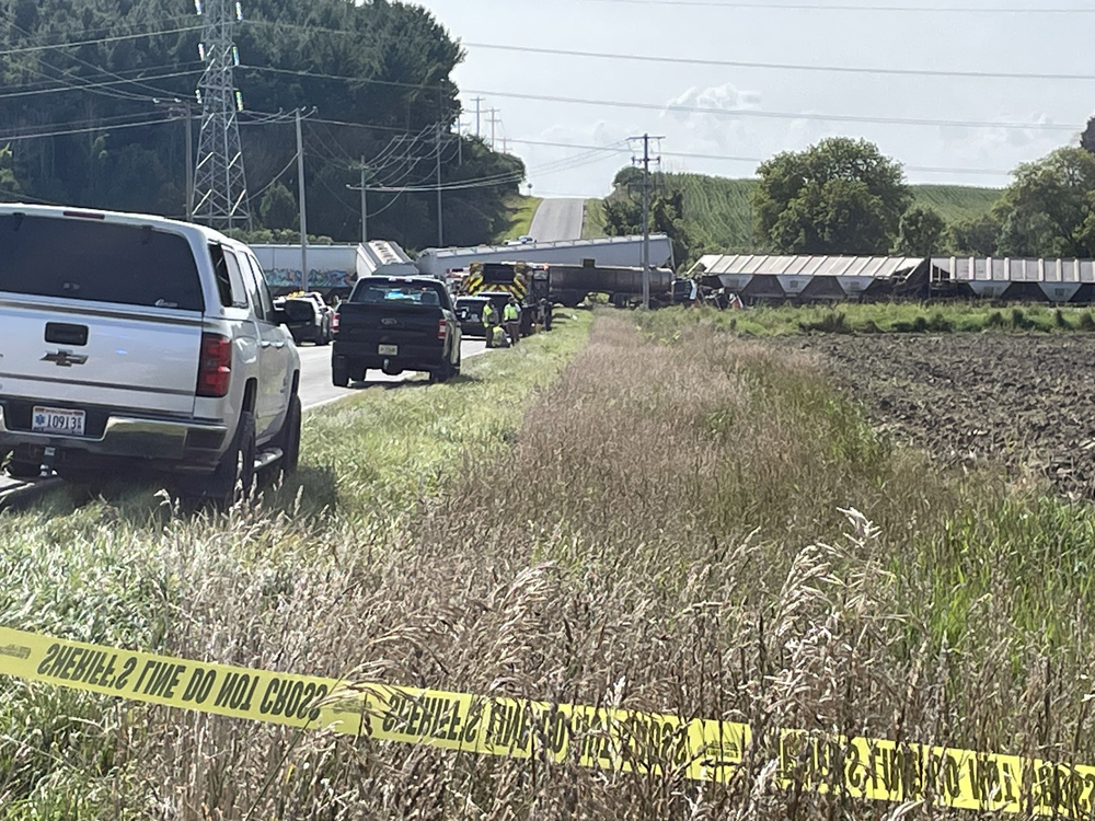 View across field of derailed cars