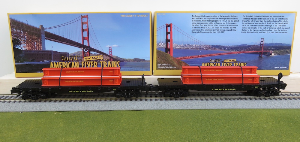 two flatcars with beams on track