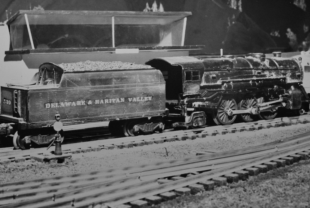 black and white photo of a model steam locomotive