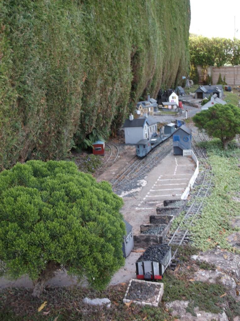 siding on garden railway with rocks and greenery