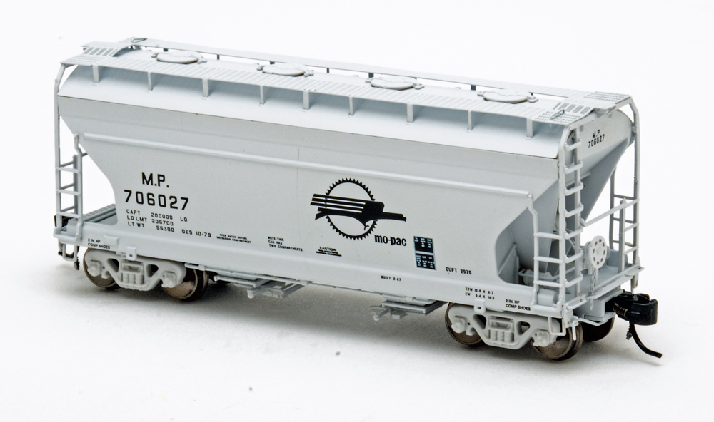 Color photo of N scale freight car painted gray with black graphics.