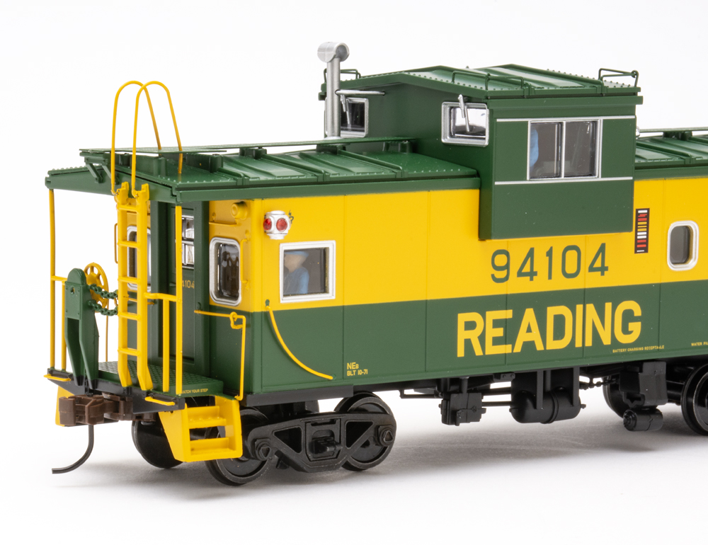 Color photo showing side view of S scale caboose.