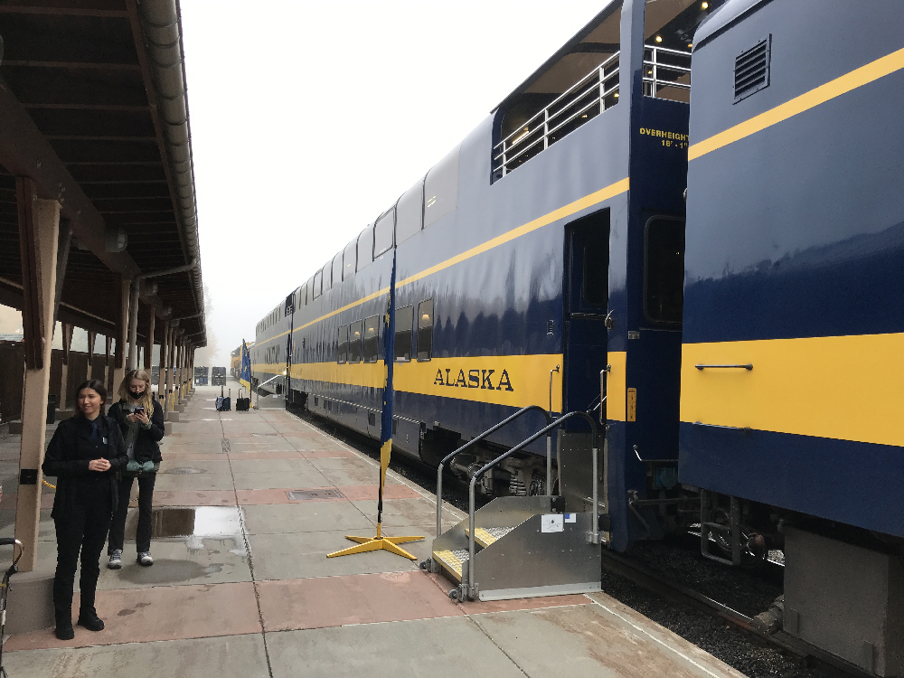 Extra-tall blue and yellow passenger car. Alaska by Rail adventure.