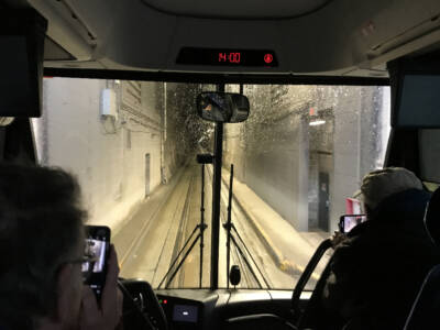 Bus entering rail/highway tunnel. Alaska by rail tour.