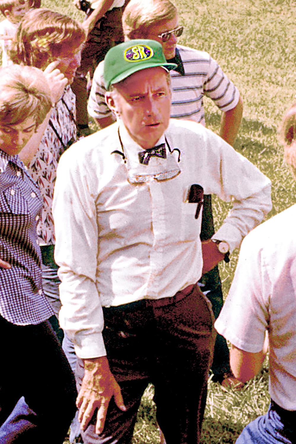 Man with green hat and bow tie