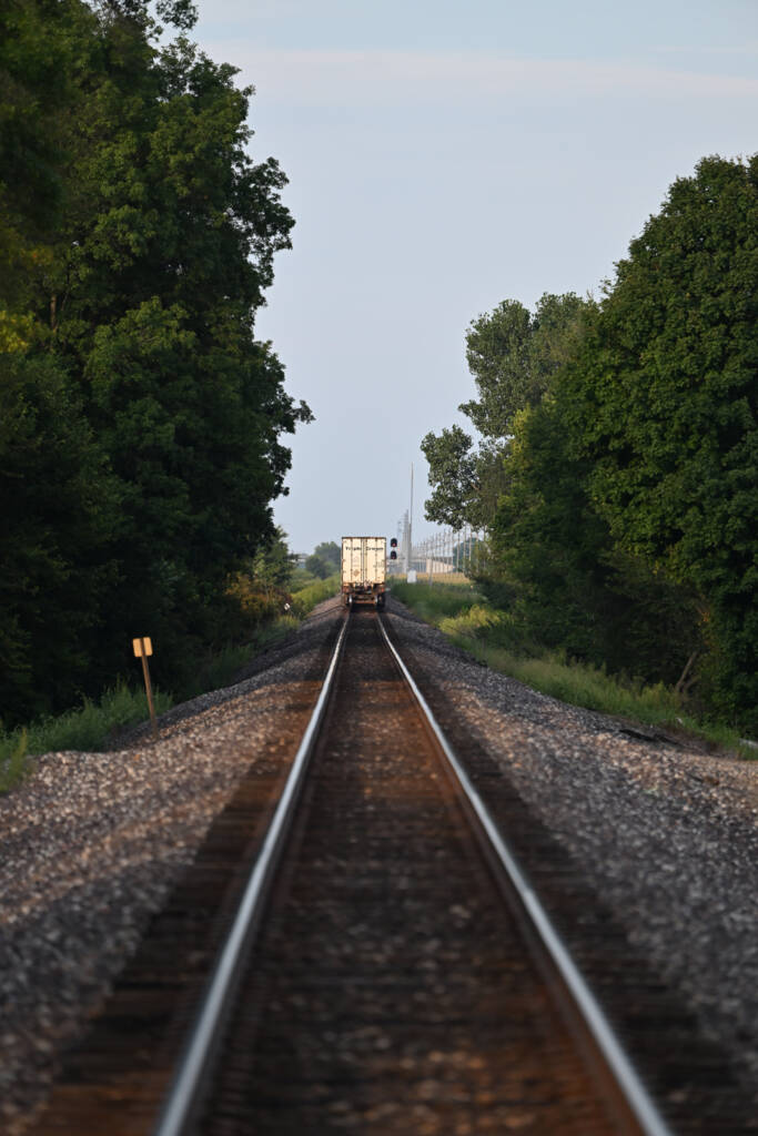 track with small white back of train