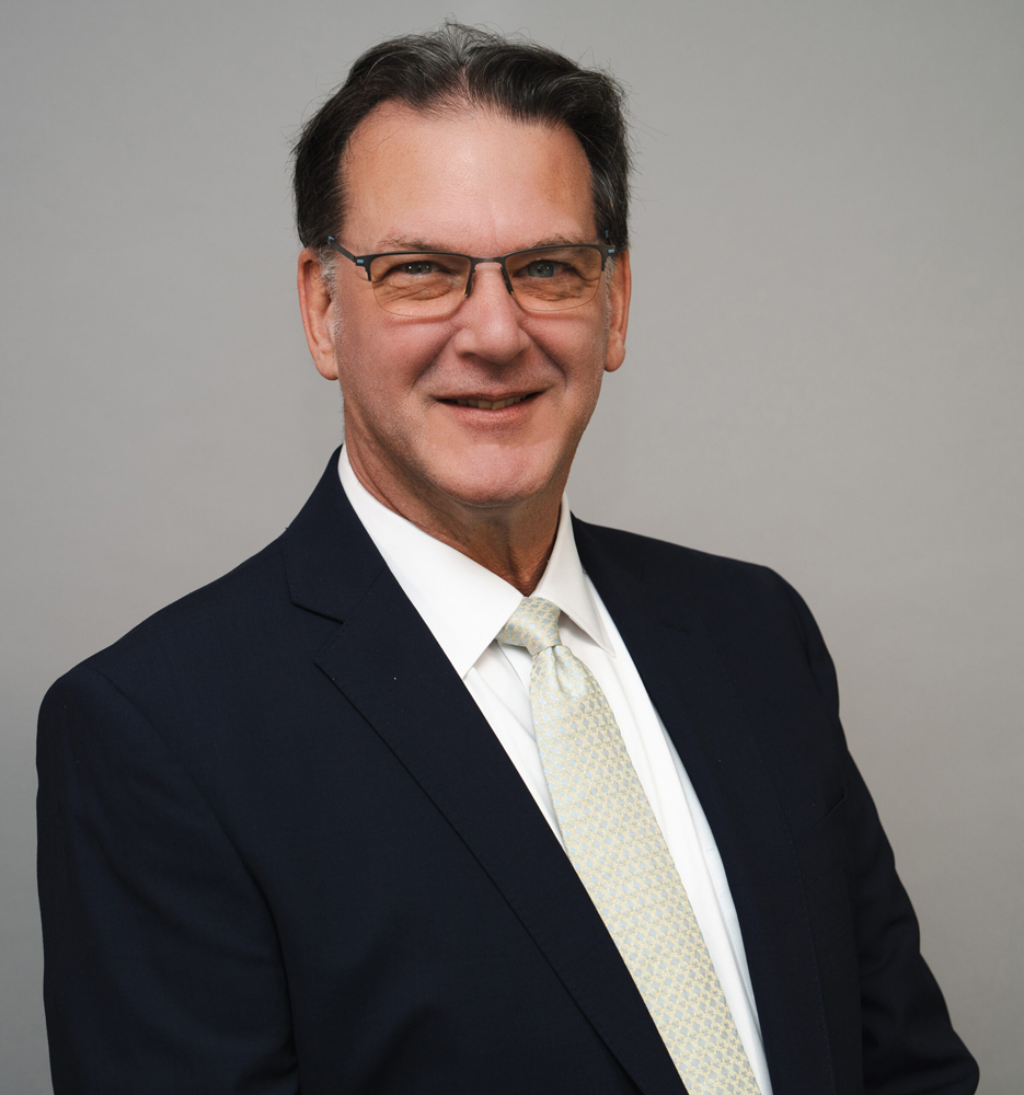 Man in suit with white shirt and tie