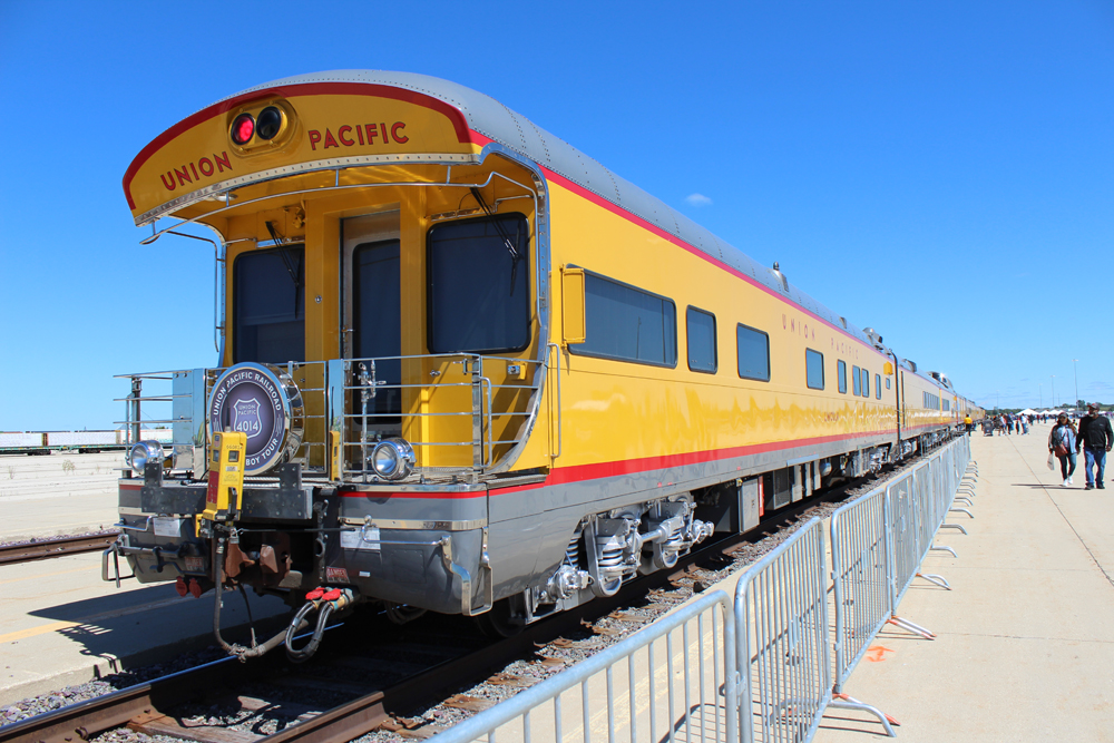 Yellow passenger car with open rear platform