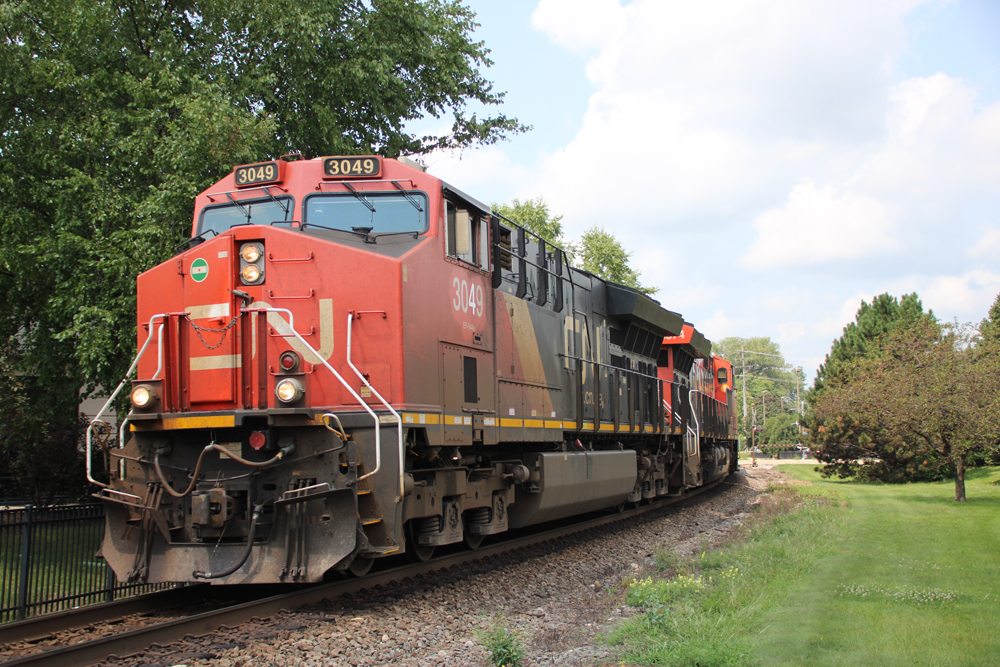 Train with red, black, and white locomotives