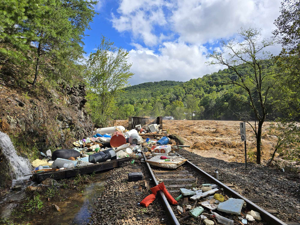 Flood waters and debris at railroad bridge