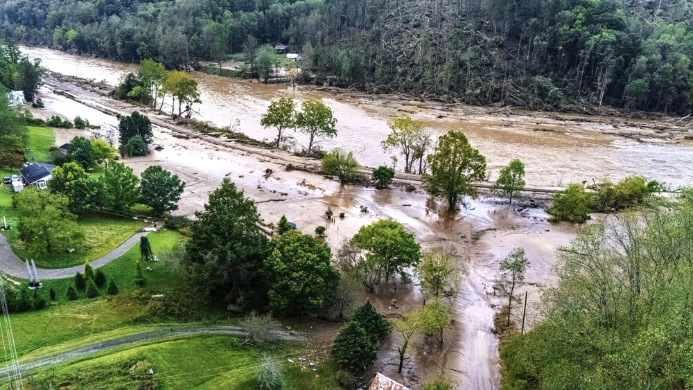 Flood damage on railroad tracks next to river