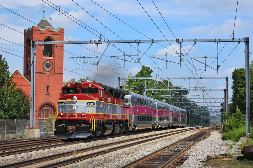 "Cranberry" red and silver locomotive with bilevel commuter coaches