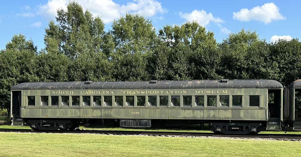 Side view of green heavyweight passenger car