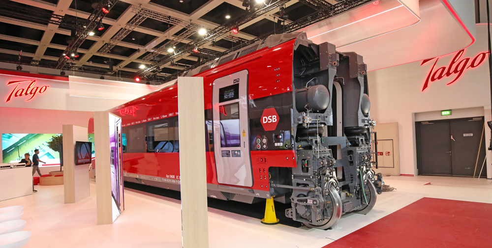 Red and gray passenger car inside building