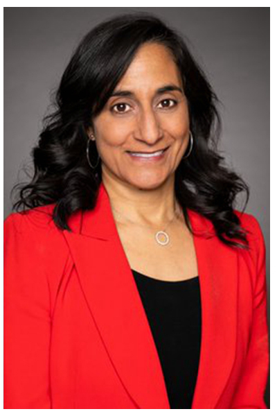 Woman with black hair wearing red coat