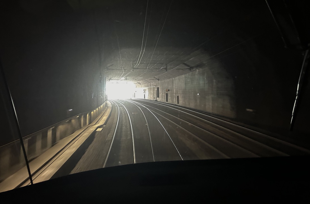 View of tunnel portal from train inside tunnel