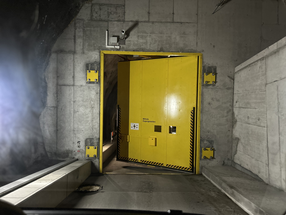 Yellow door in concrete wall