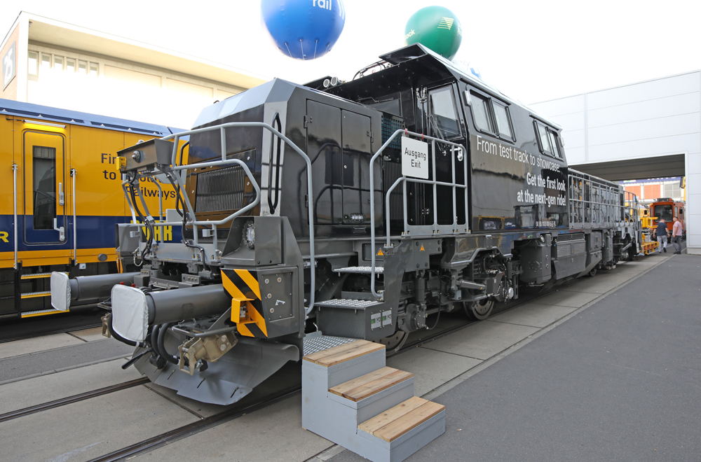 Black locomotive with large center cab