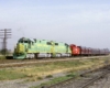 Diesel Illinois Terminal locomotives pull maroon passenger cars